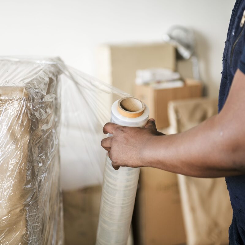 man packing boxes for moving