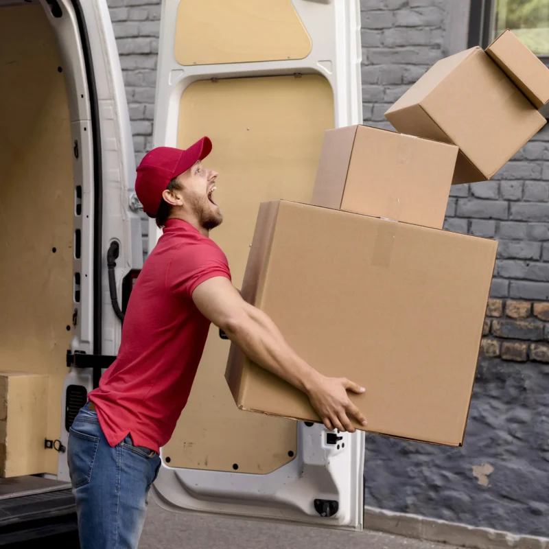 man drops boxes